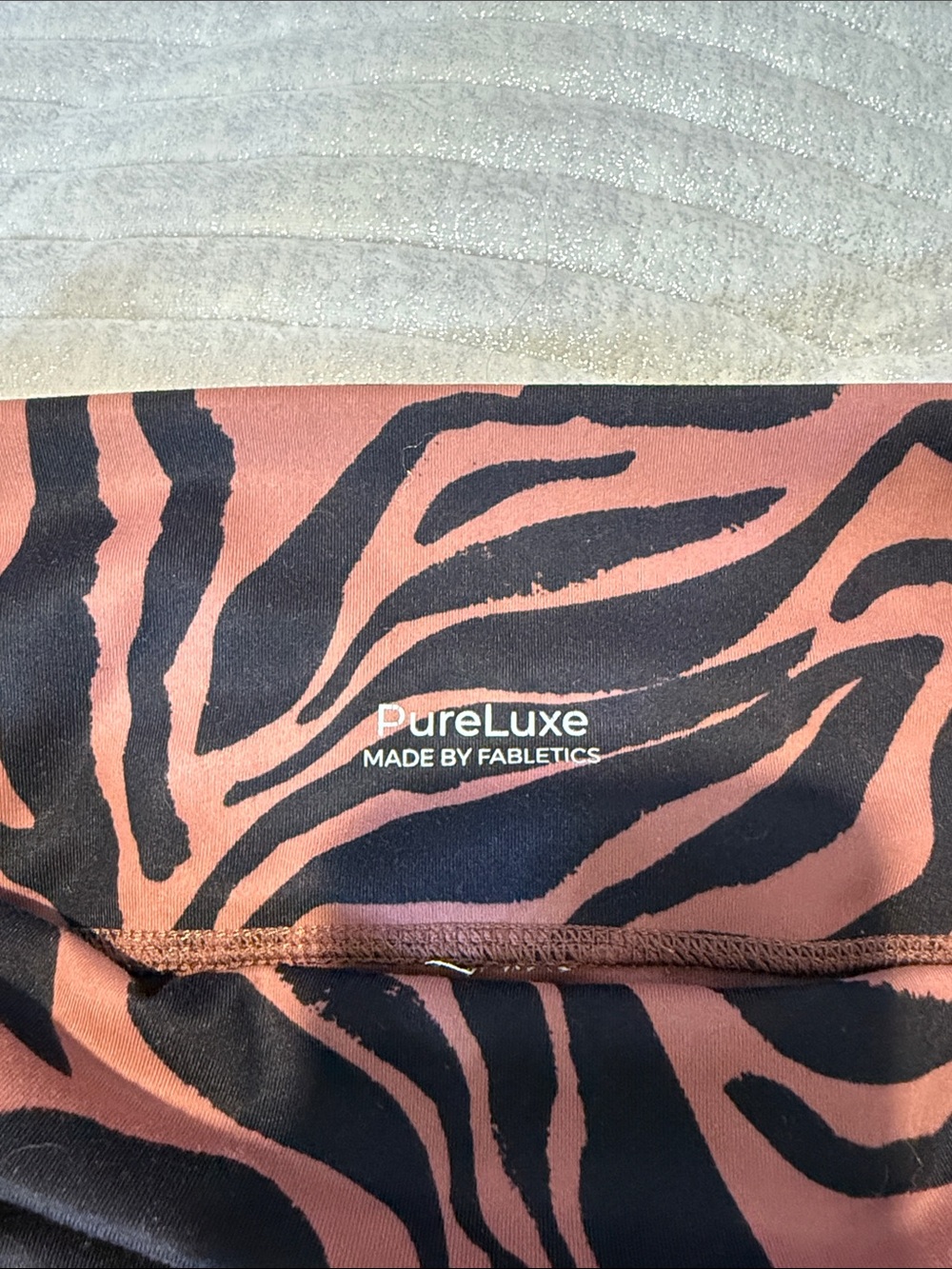 Fabletics PureLuxe Zebra Legging - Rust Pink & Black